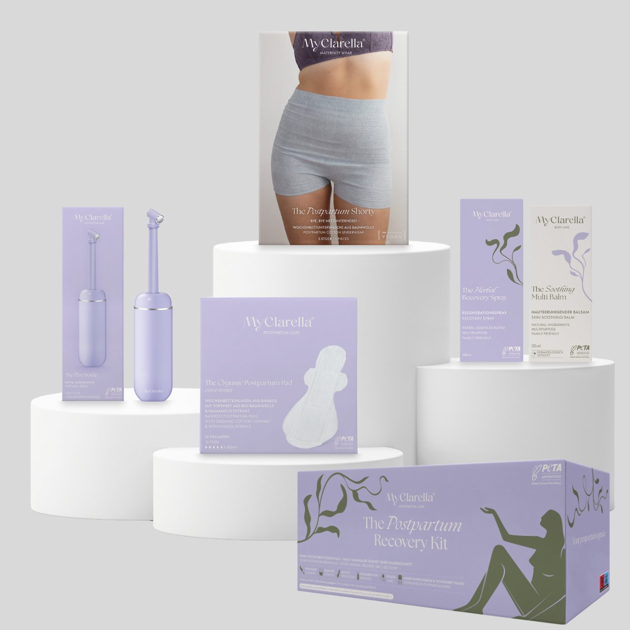 Mama Wochenbettbox - Vaginale oder Bauchgeburt - The Postpartum Recovery Kit - MyClarella - Überblick aller enthaltener Produkte: Peri Bottle, Organic Postpartum Pad Extra Strong, Postpartum Shorty, Herbal Recovery Spray, Soothing Multi Balm